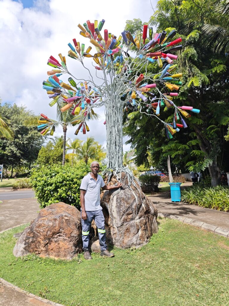 Valerio in front of the Bottle Tree.